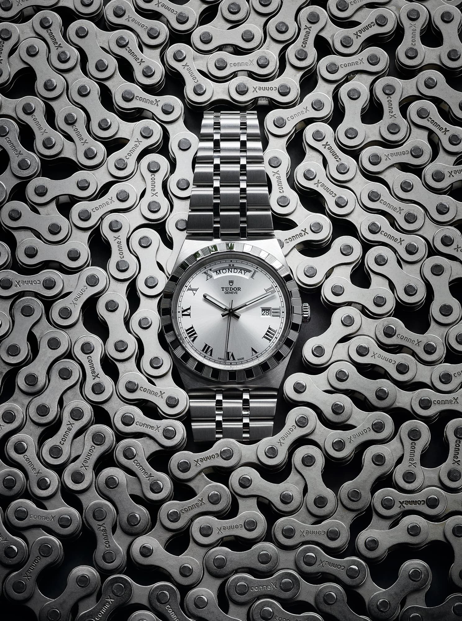 still-life-photography product-photography advertising-photography fashion accessories metal men watch surrounded by bicycle chain